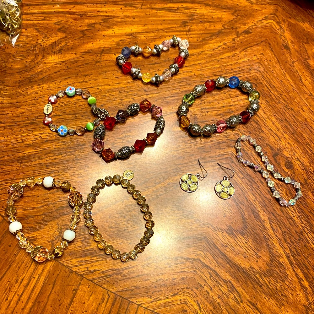 7 beaded bracelets and 1 pair of earrings